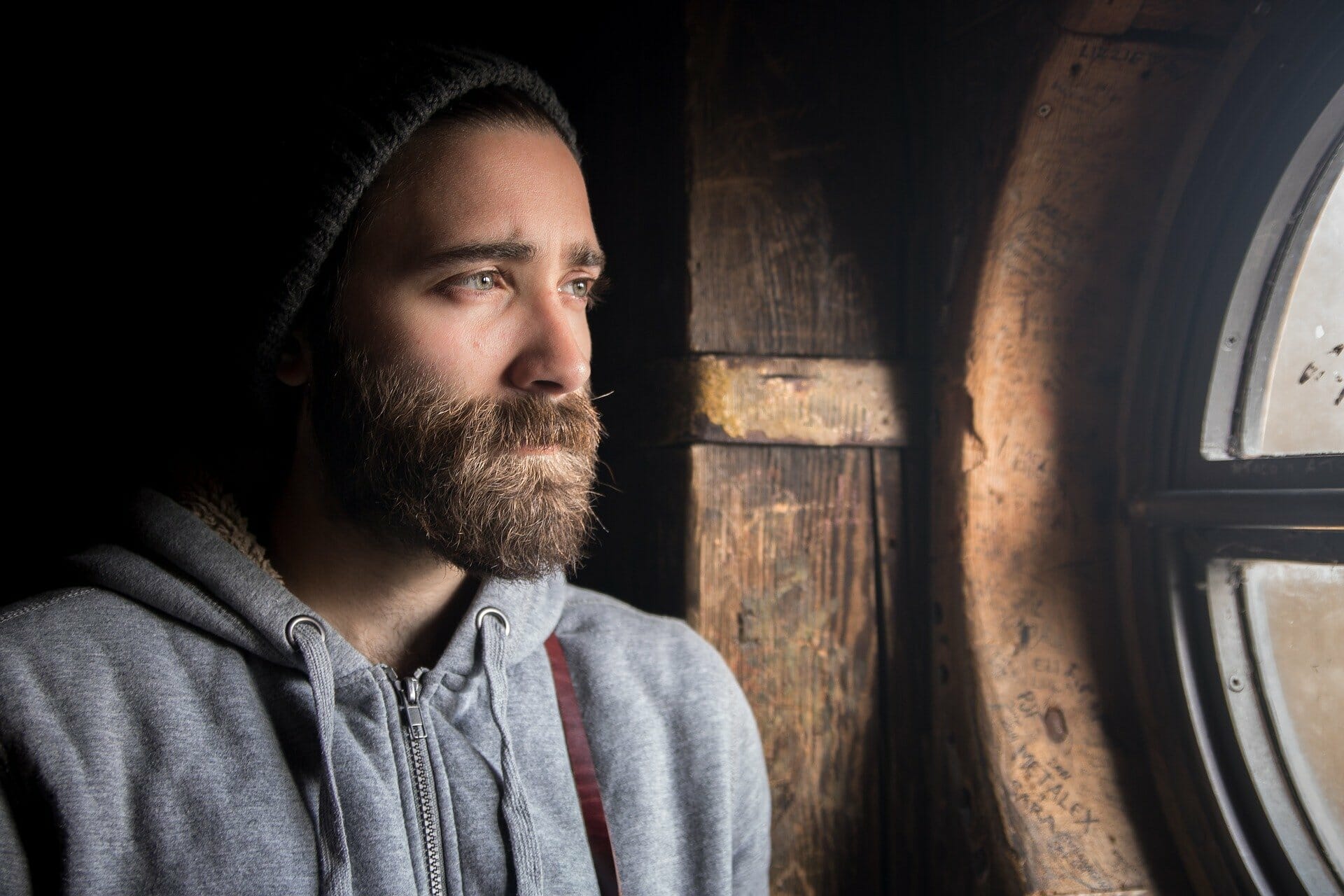 Living With Regret How to Get Over Regret man looking out window