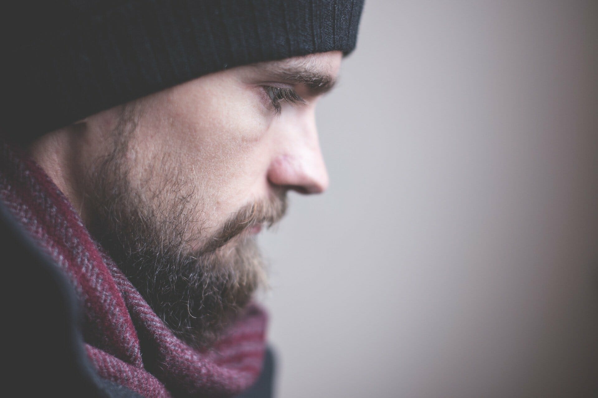 Why do I suck at everything man with bear and beanie looking sad